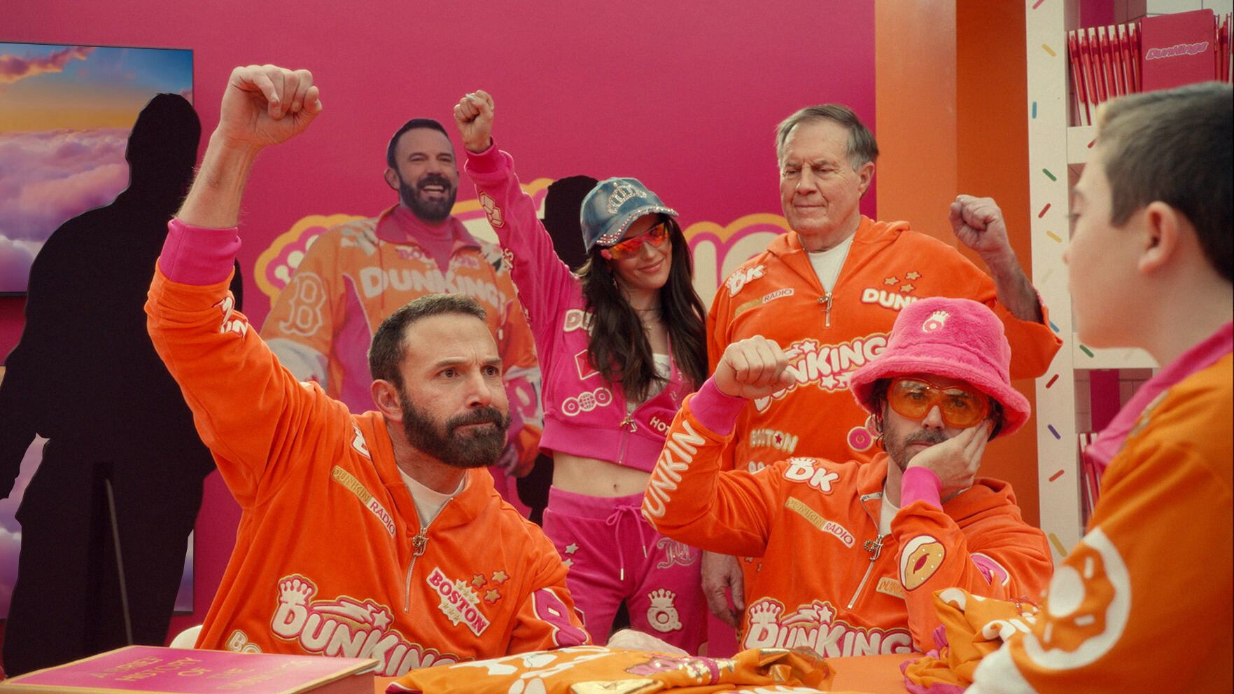 Picture of people wearing Dunkin' Donuts tracksuits.