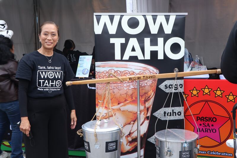 Owner next to food botoh