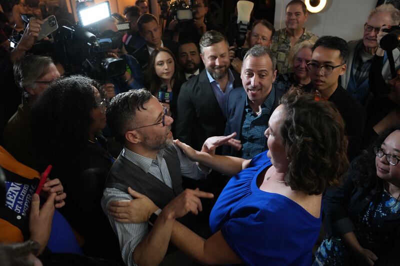 Porter stands among the crowd of her supporters in the audience after her speech.
