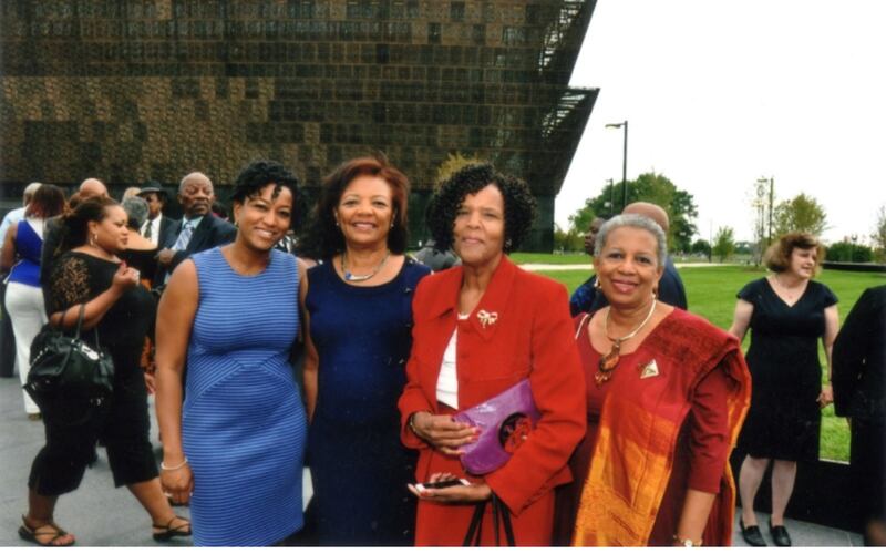 "A photo of Leah Jackson, Barbara Boyd, Natalie Mallard, and Velma Marshall smiling as a group at a museum Donor Reception."