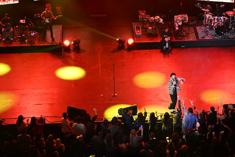 Crowd gathers in front as Aslam sings.