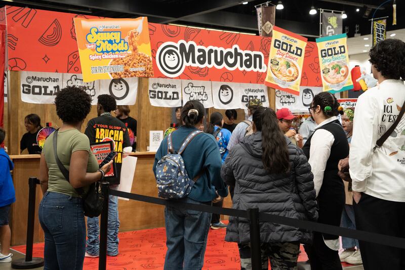 Photo of the Maruchan instant ramen booth with attendees lined up waiting to try the samples.