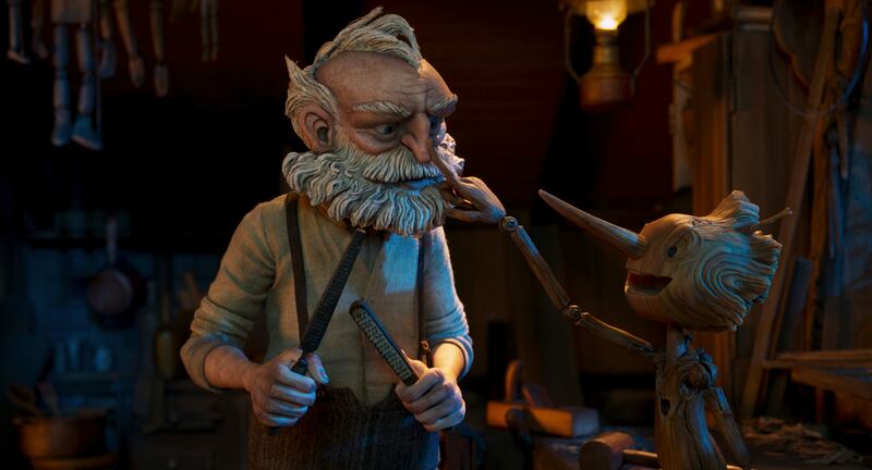 Film screenshot of an animated old man with a puppet