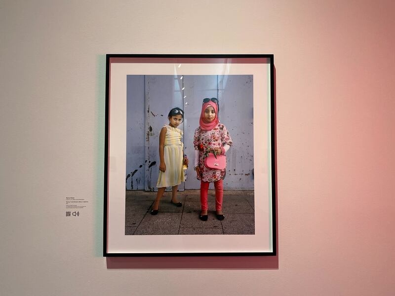A photo of a framed photograph of two young girls.