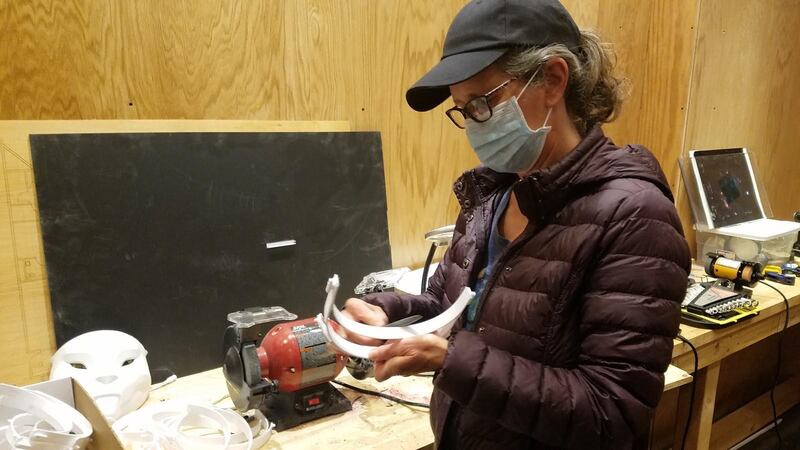 PVNet Volunteer deburring the 3D printed part of a face shield [Photo courtesy of PVNet]