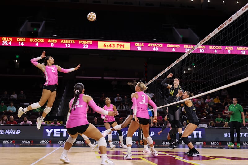 London Wijay (2) rises up from behind the back line to hit an inbound volleyball across the net against the Oregon Ducks.