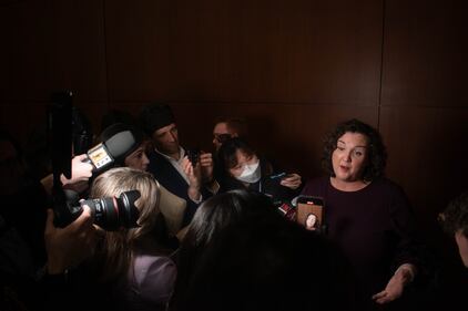 Photo of reporters interviewing Katie Porter