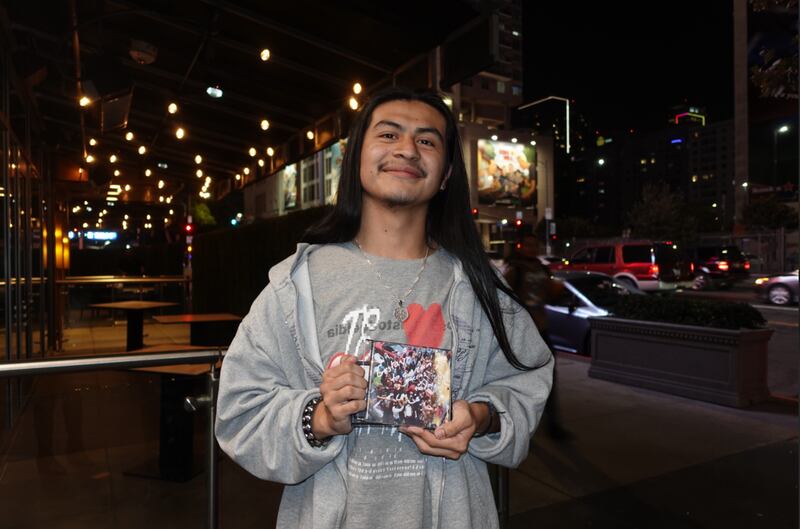 Fan with music album