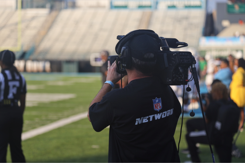 A cameraman is recording the HBCU Legacy Bowl.