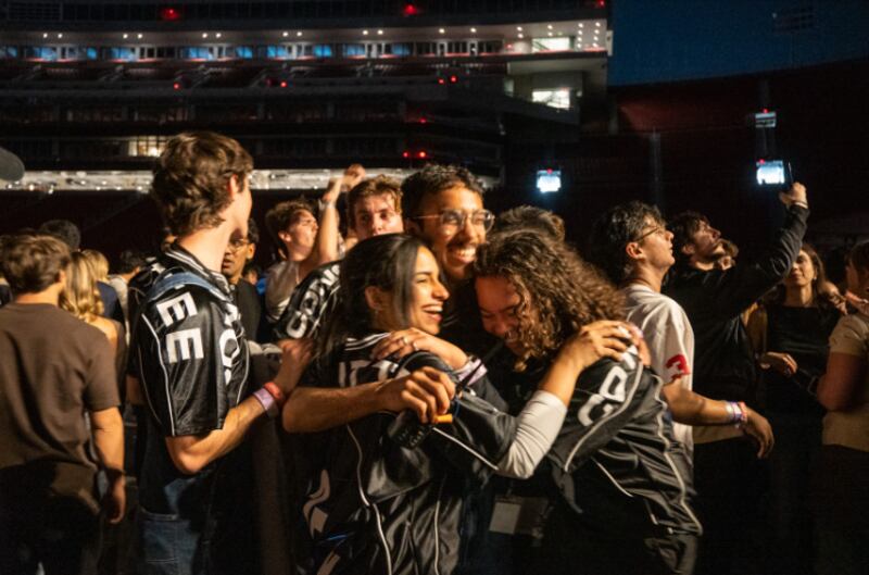 Some members of the Concerts Committee share a proud embrace in the crowd, celebrating the success of the show they brought to life. (Photo by Darcy Hatcher)