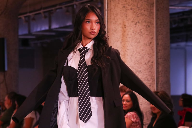 Female model with coat and tie