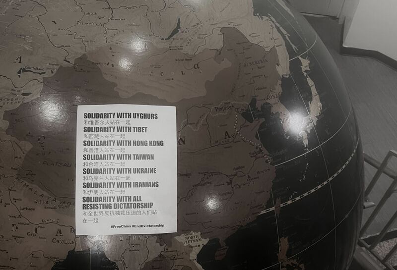 A poster on a large globe