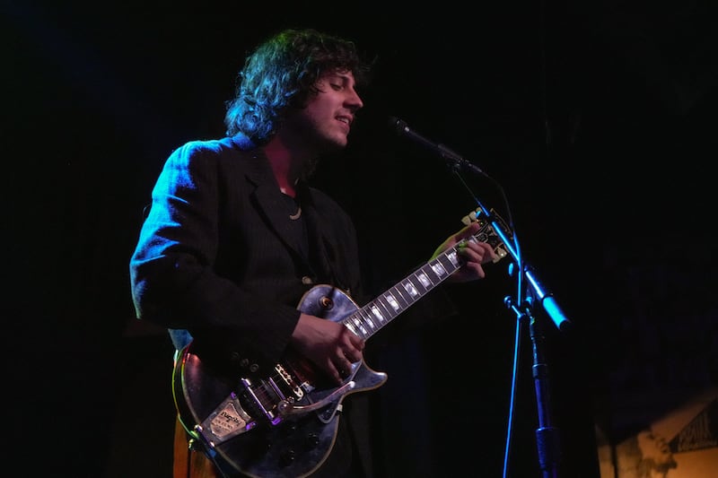 DESCRIBE THE IMAGE FOR ACCESSIBILITY, EXAMPLE: Photo of a chef putting red sauce onto an omelette.