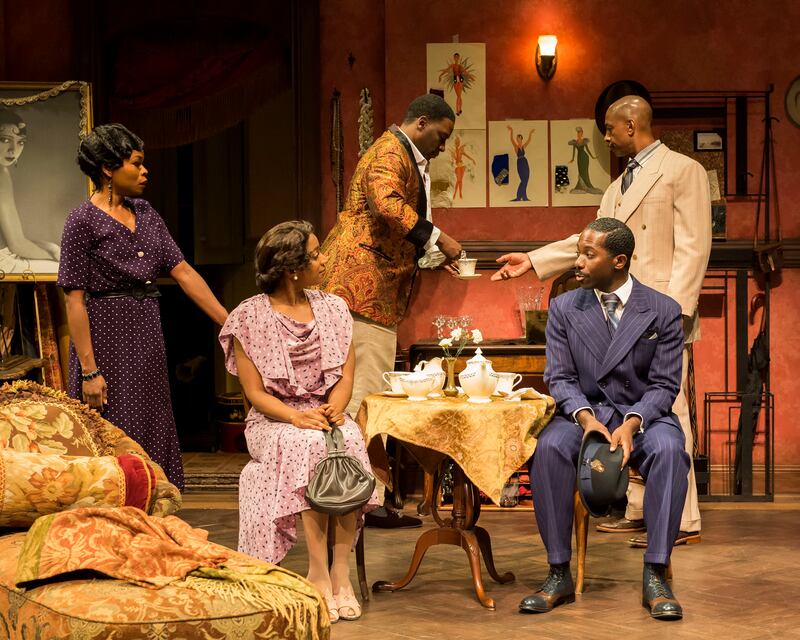 The cast of "Blues for an Alabama Sky" are having a gathering together in Guy's apartment, having tea.