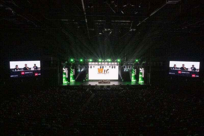 An audience watching a panel