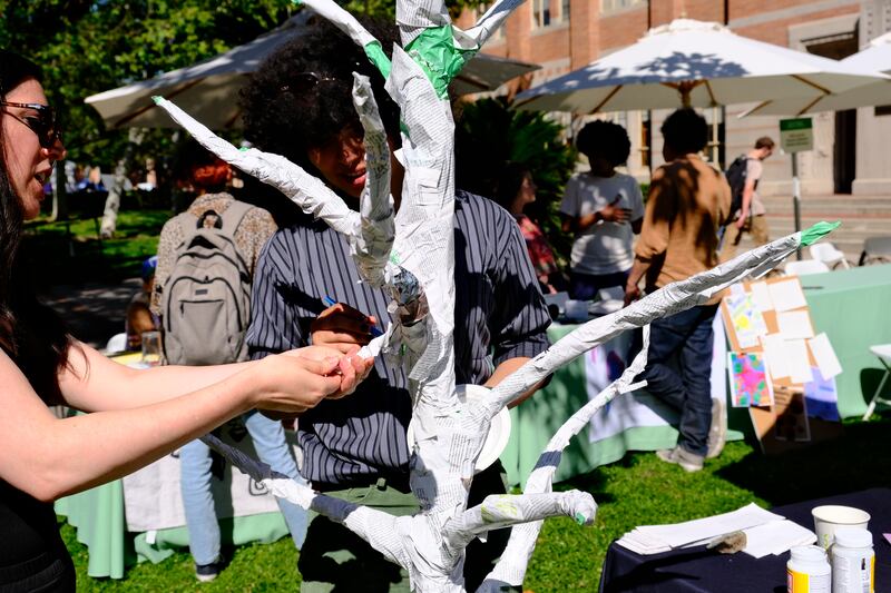 Students assembled paper trees during the Arts & Climate Collective annual festival.