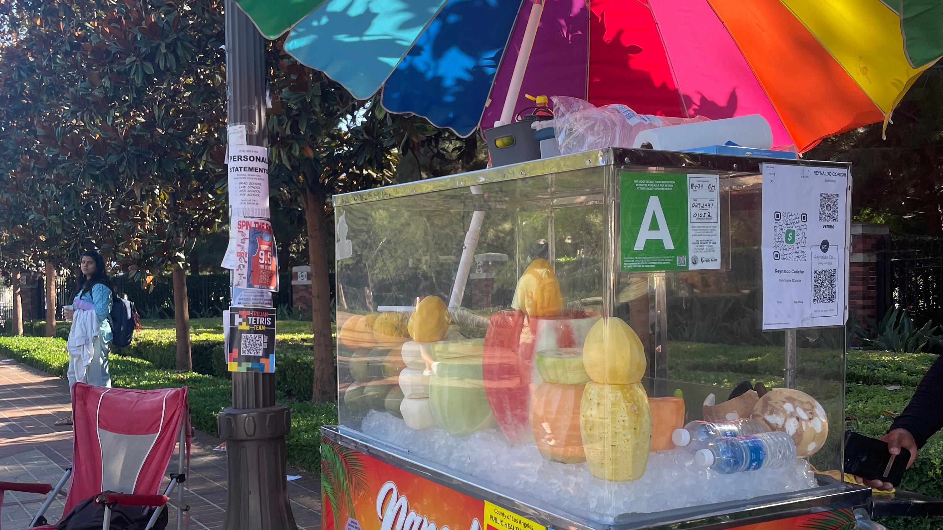 Alonso Lopez's fruit cart sits in front of USC's Jefferson and Hoover entrance.