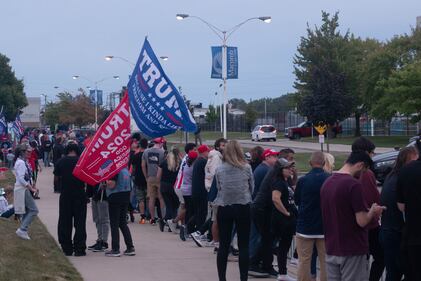 DESCRIBE THE IMAGE FOR ACCESSIBILITY, EXAMPLE: Photo of a chef putting red sauce onto an omelette.
