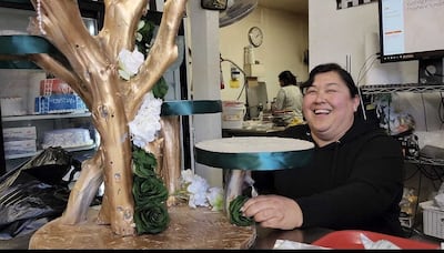 DESCRIBE THE IMAGE FOR ACCESSIBILITY, EXAMPLE: Photo of a chef putting red sauce onto an omelette.