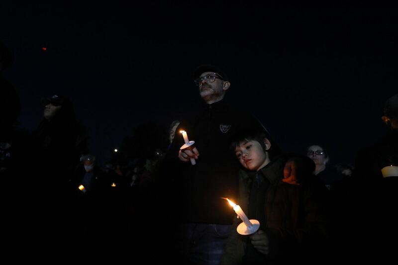 Photographs of a vigil outside the Monterey Park civic center held for the victims of the Monterey Park mass shooting.