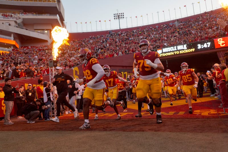 Football players running out on to the field