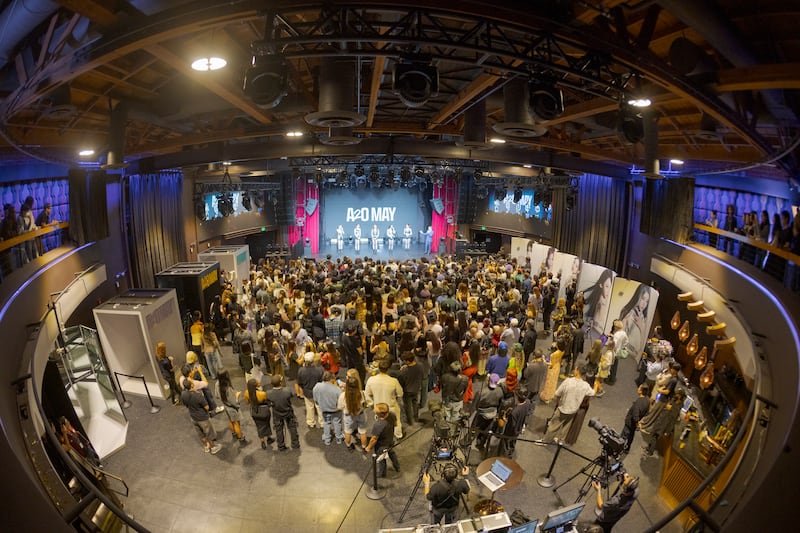 Fans gathering around a stage