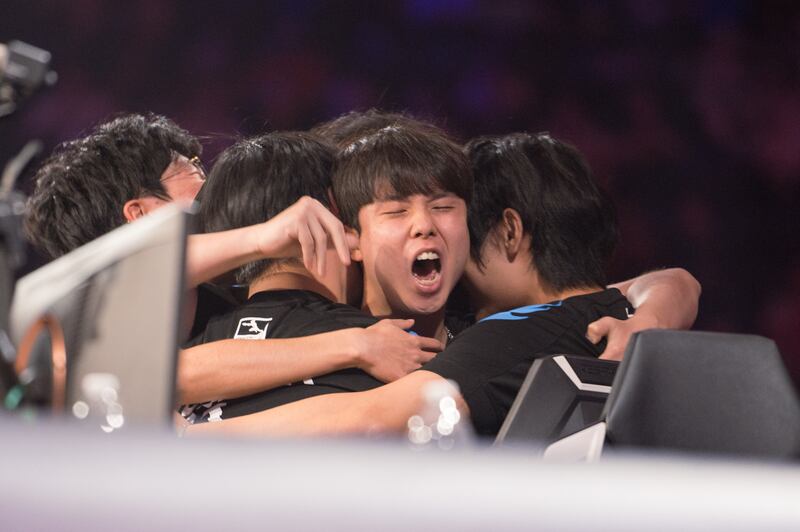 Lee “Fearless” Euiseok triumphantly embraces his teammates as soon as “Dallas Fuel wins” flashes across the screen. (Photo by Michael Chow)