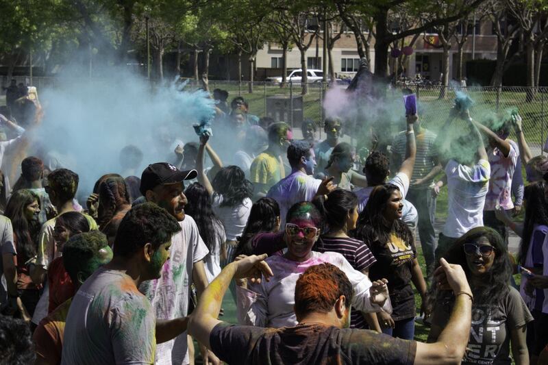 Students playing with colors and dancing to music.