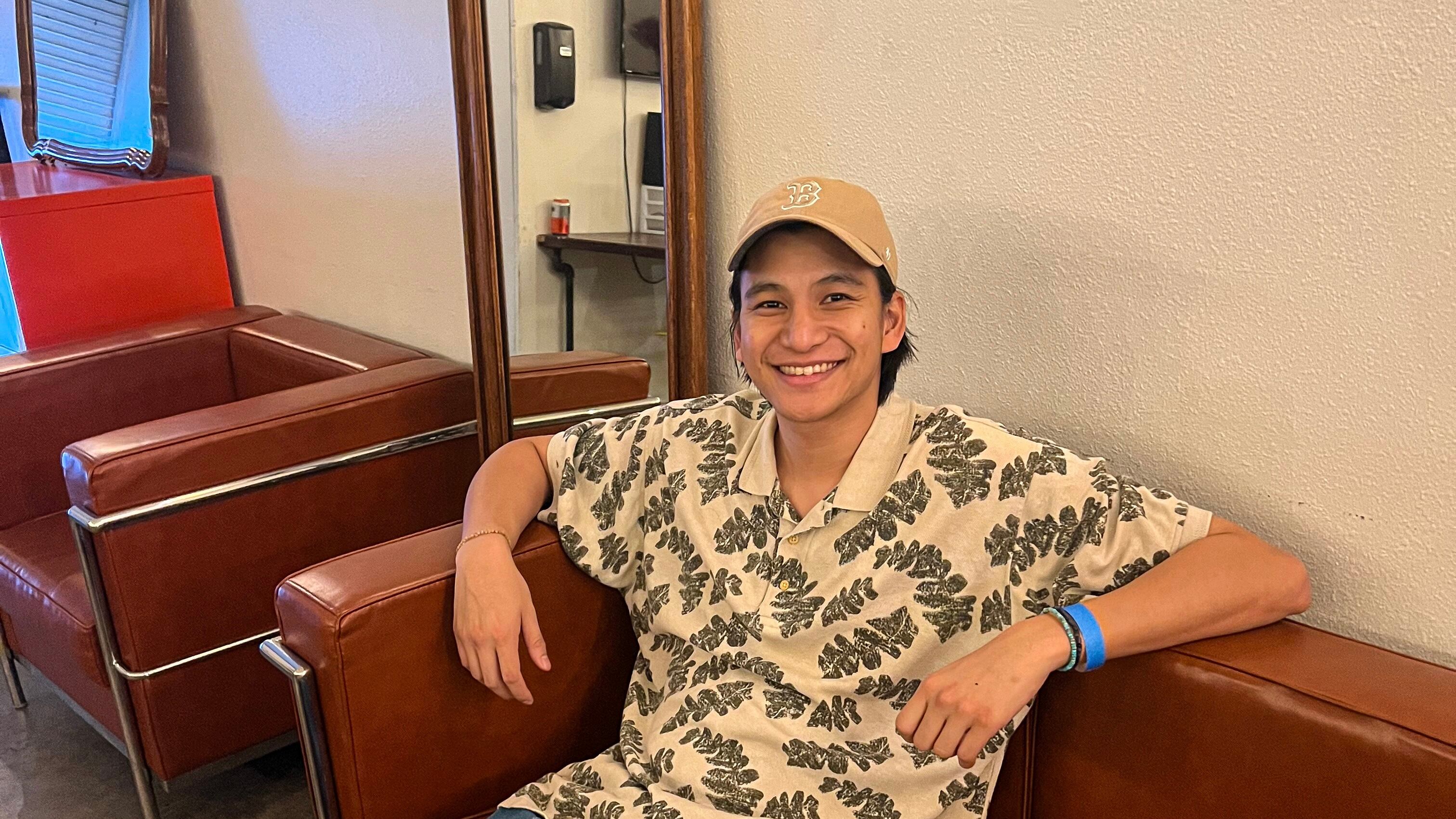 Photo of a man sitting on a couch