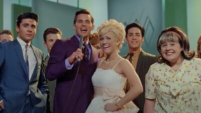 [The cast of 'Hairspray' smile at the end of the fictional 'Corny Collins Show'.]
