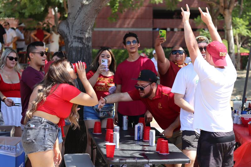 Students play tailgating games prior to the start of the football game.