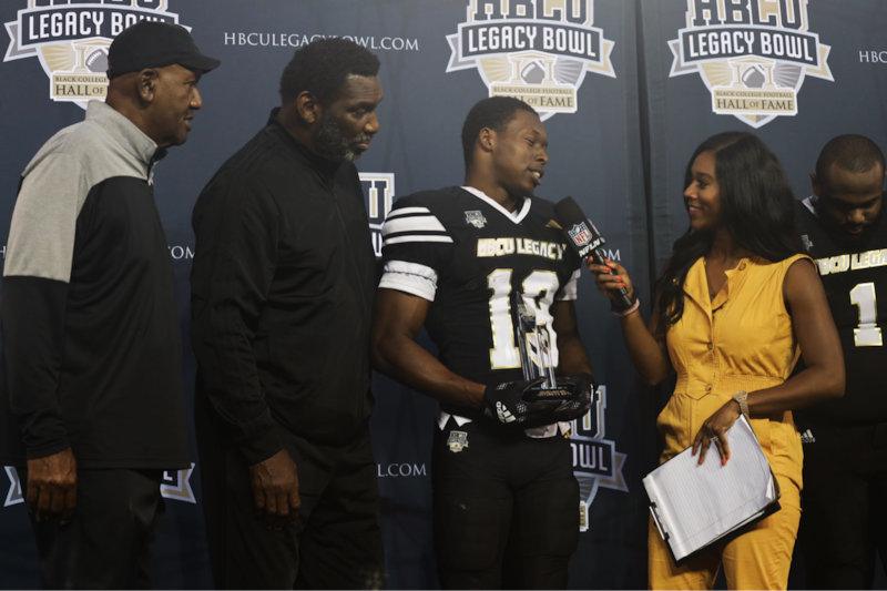 Offensive MVP Xavier Smith holding his trophy as the NFL Network’s Sherree Burruss interviews him post-game.