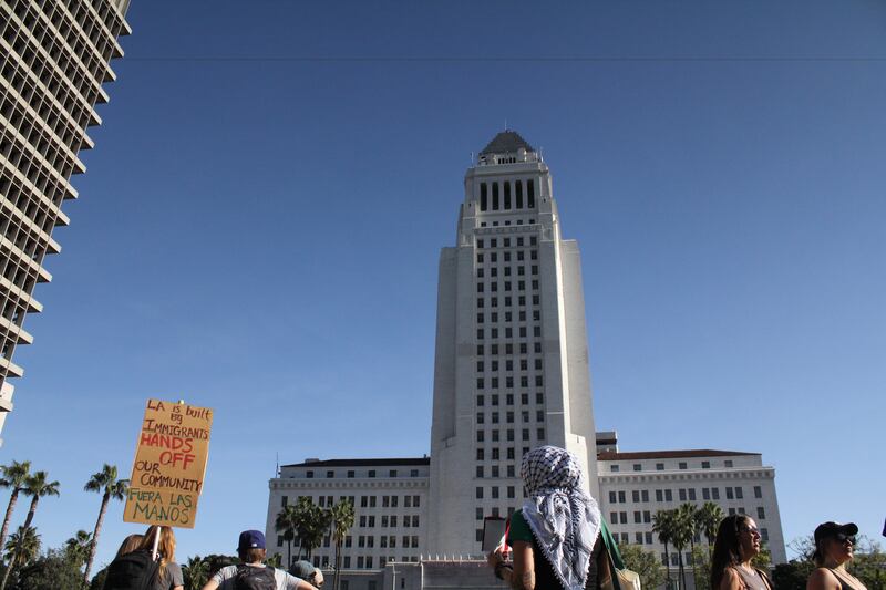 Protestors stand in Gloria Molina Grand Park on Jan. 30 to protest ICE in Los Angeles.
