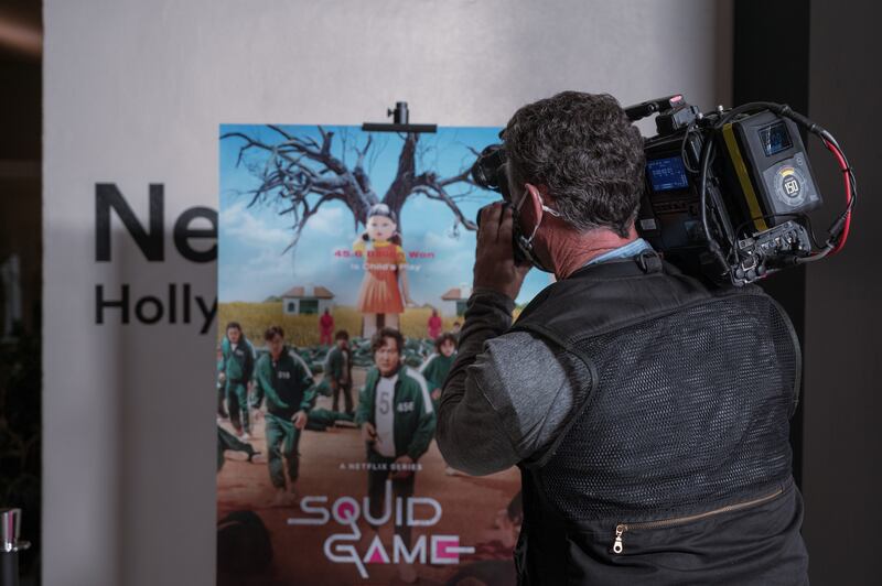A cameraman captures B-roll footage at the "Squid Game" Red Carpet event hosted by Netflix at NeueHouse Hollywood on 8 Nov 2021.