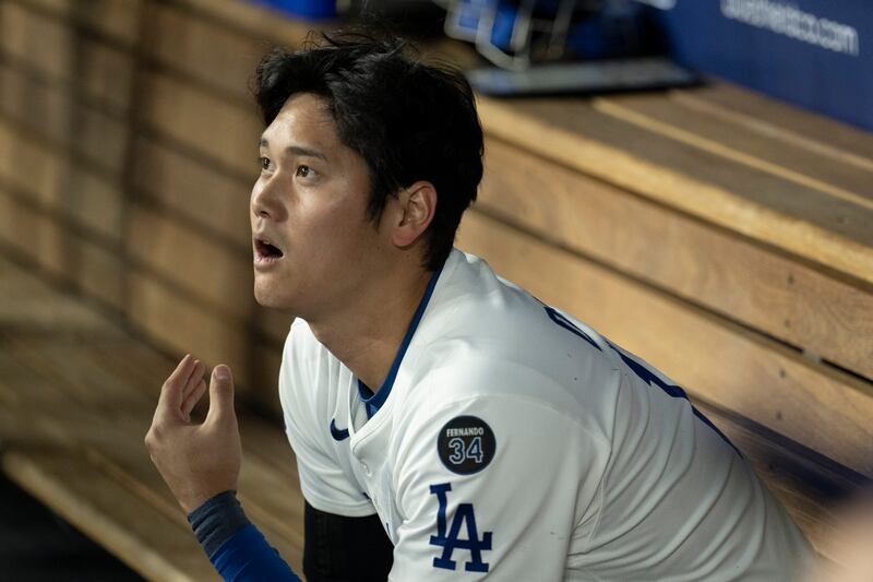 Photo of a baseball player looking on in awe.