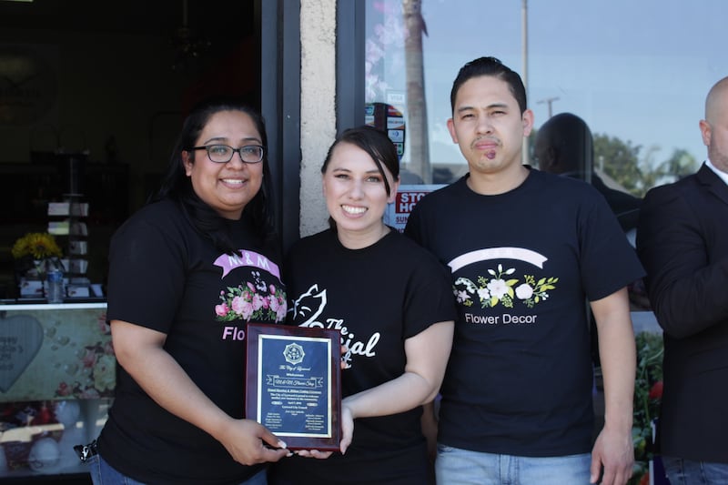 A photo of Daniela with small business owners
