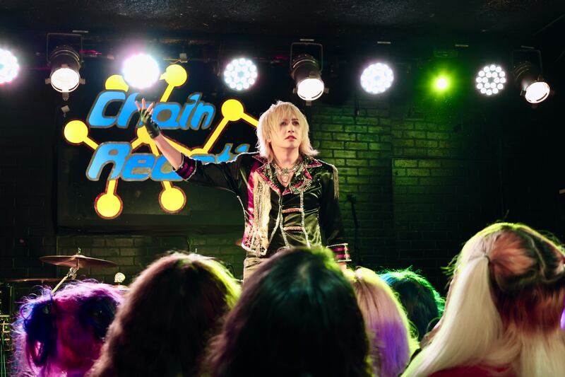 Artist gazing out toward the crowd