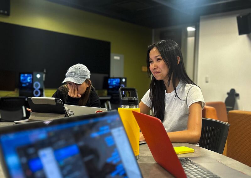 A photo of two students at work.