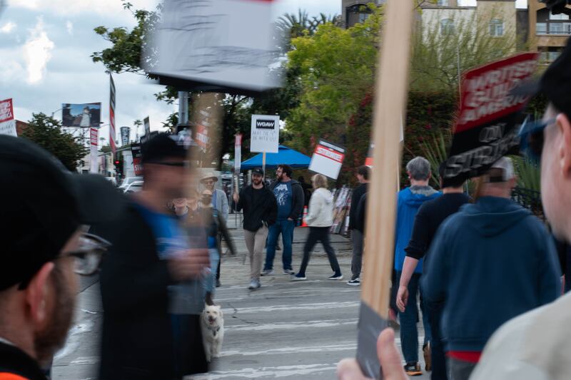 Wolkoff makes sure people are continually moving through the crosswalk during the walk phases to disrupt traffic that attempts to enter CBS.