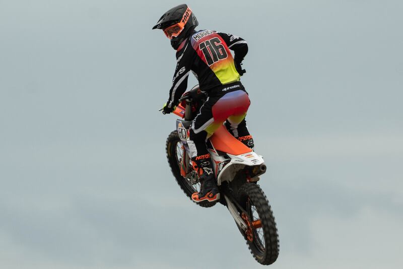 Ryan Morais looks back at Derek Kelley, who had made a mistake on a jump. Despite this, Kelley came back to win third place in the Straight Rhythm 125cc group.