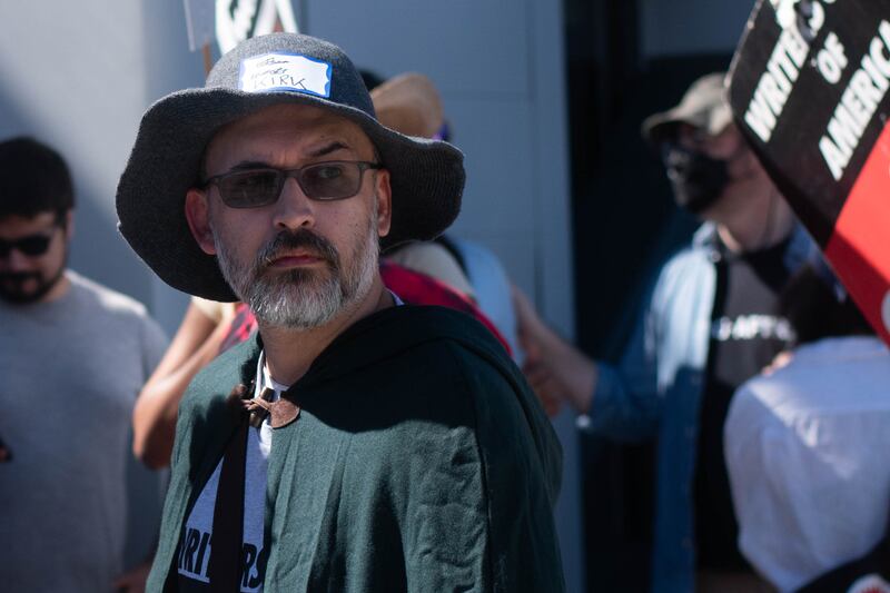 A writer dressed as a wizard at the picket.