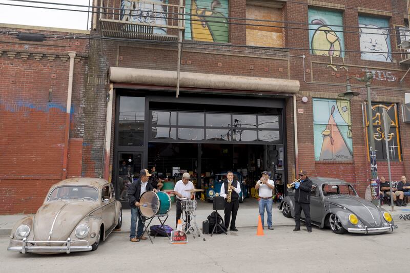 Band playing in front of a garage