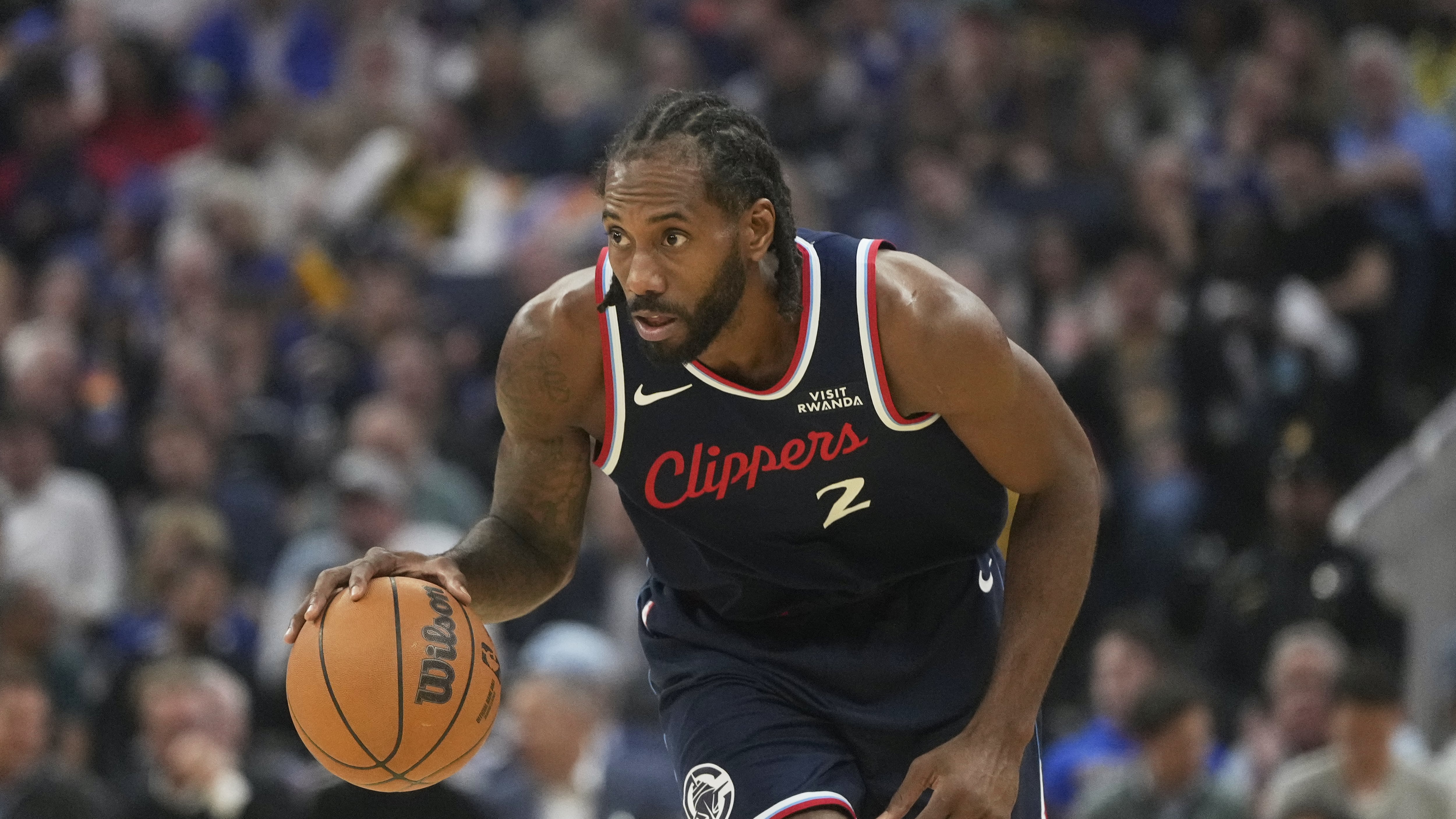 DESCRIBE THE IMAGE FOR ACCESSIBILITY, EXAMPLE: Photo of a chef putting red sauce onto an omelette.