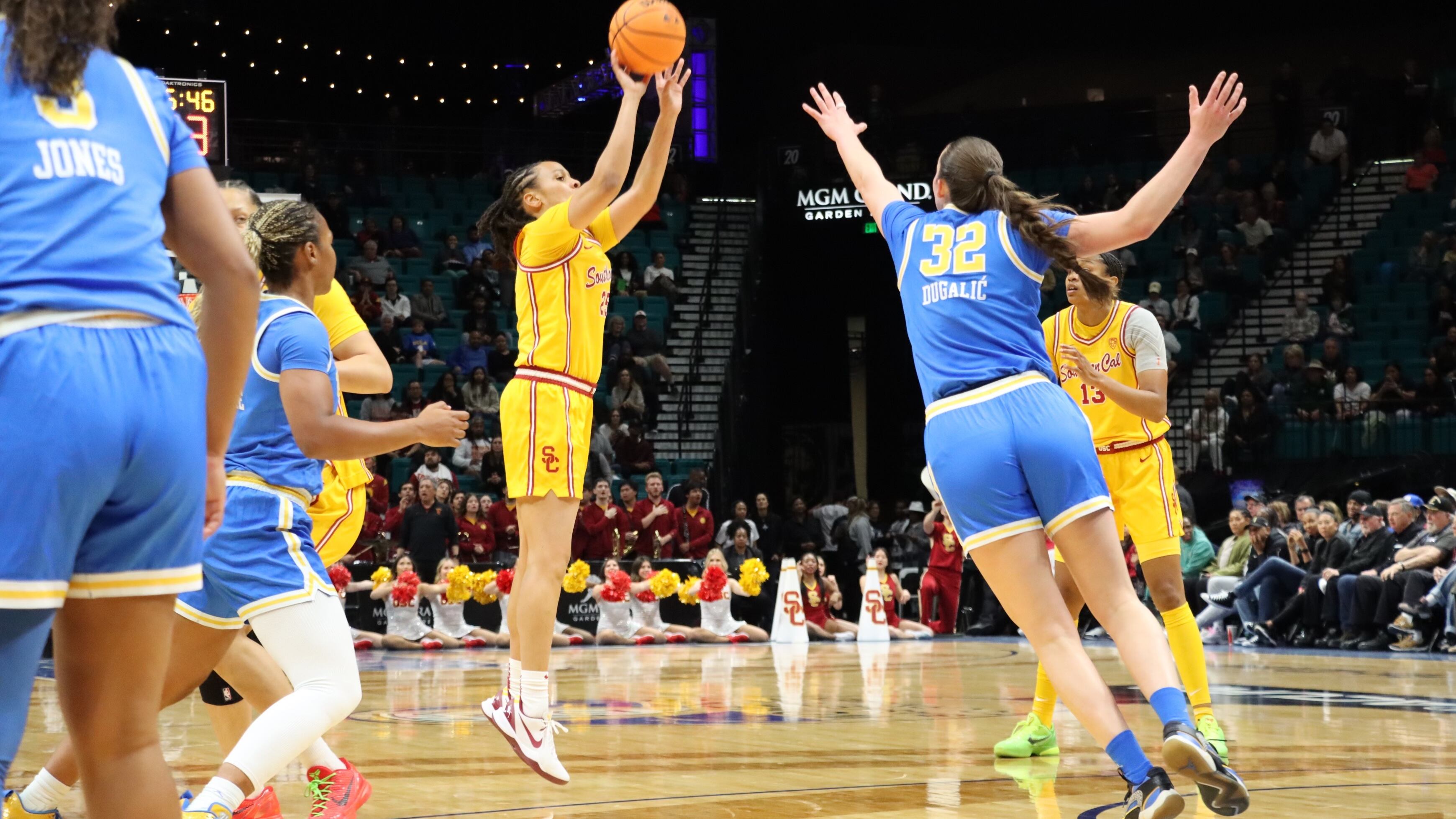 Forbes takes a three from the wing with Angela Dugalic reaching out to defend it.