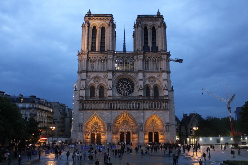 On Monday night, Notre-Dame Cathedral in Paris, usually bustling with long lines of tourists, was closed to visitors, allowing only those attending the vigil to pass through its doors. (Photo by Charlotte Calmès)