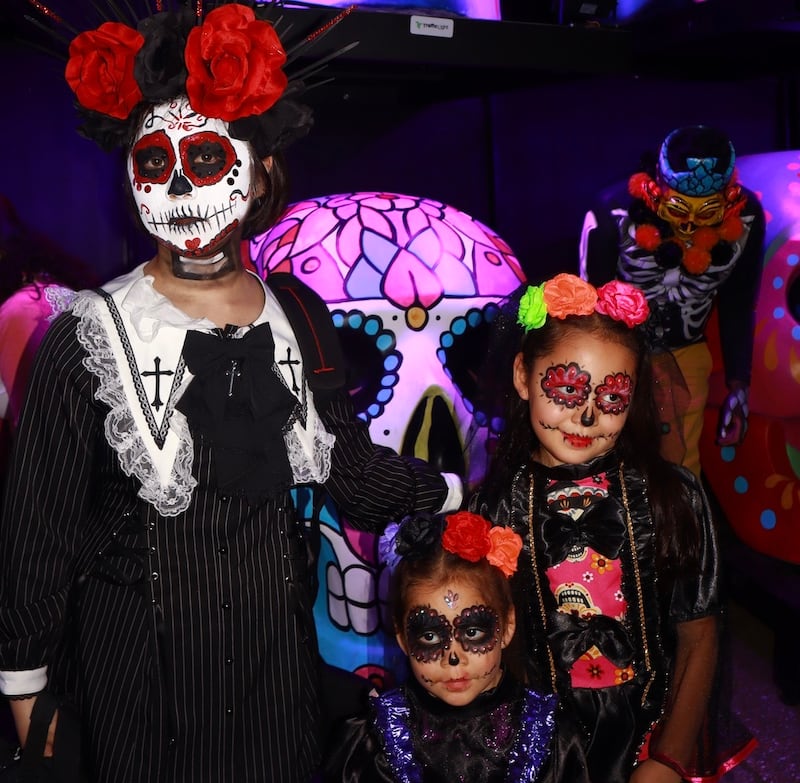Day of the Dead skull makeup in different colors.