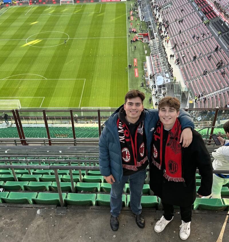 Ethan Pollack and Jude Ocañas take in a match between AC Milan and Inter Milan at the San Siro on Feb. 2, 2025 (Jude Ocanas)
