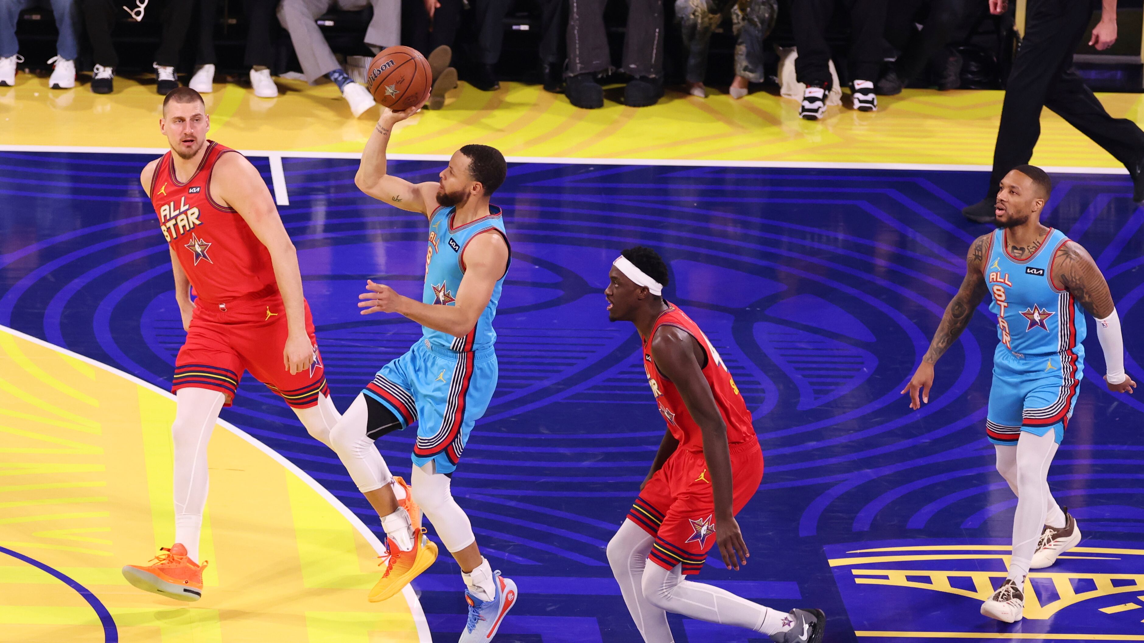 Stephen Curry attempts a floater while Nikola Jokic, Pascal Siakam and Damian Lillard watch.