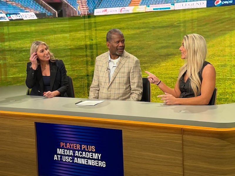 McCall Zerboni (left) and Julie Ertz (right) work with Rob Parker on postgame analysis techniques. (Photo by Jeida Mitchell)