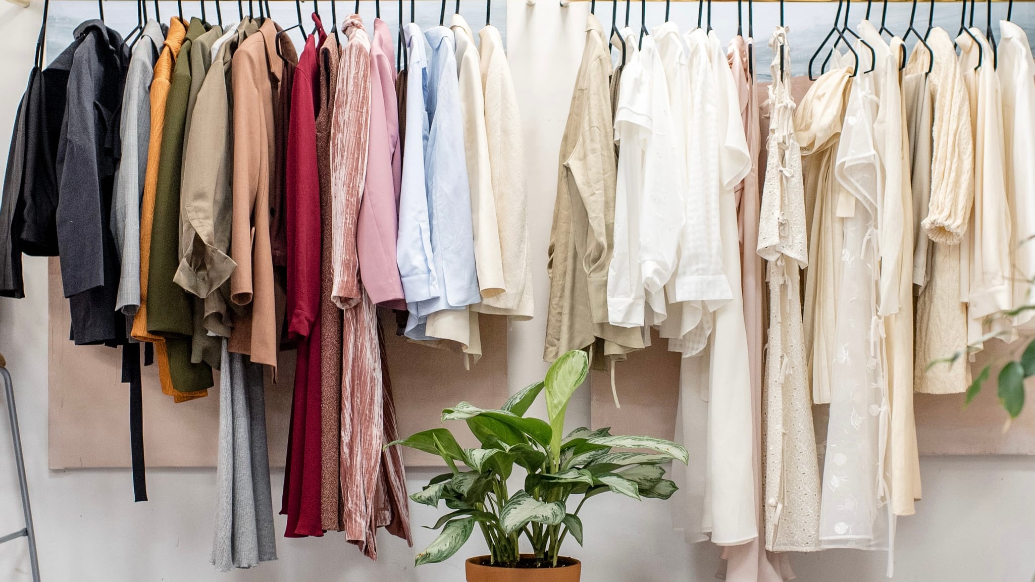 Photo of a clothing rack with pieces resembling Matilda Djerf's styles.